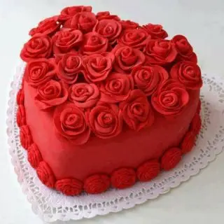 Red velvet Heart shape premium quality 1 kg cake with red roses topping