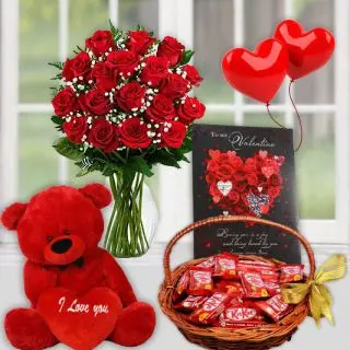 Romantic Surprise -- 15 red roses in glass vase, basket of kitkat chocolates, 1 feet height red teddybear with pair of heart shape balloons 