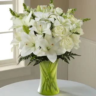 white lilies with white roses beautifully arranged