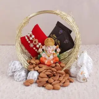 Set of 2 rakhi, ganesha idol, 2 bournville chocolates, 250 grams almond with 250 grams kaju roll sweets 