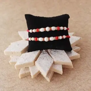 set of 2 rakhi with 250 grams kaju katli sweets 