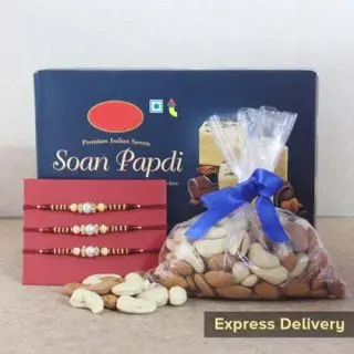 set of 3 rakhis , 200 grams assorted dryfruits with box of half kg soan papdi sweets 