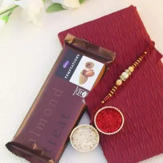 Temptation chocolate bar with Rakhi and roli chawal  