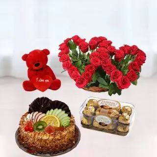 Twin heart shape arrangement of 30 red roses , 16 pcs rocher ferrero chocolates, premium butterscotch fruit cake , with 1 feet height red teddybear 