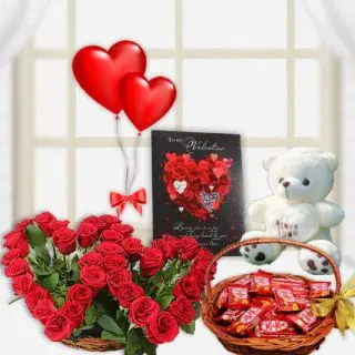 Twin heart shape arrangement with basket of kitkat chocolates with 6 inch teddybear with greeting card and pair of 2 heart shape balloons 