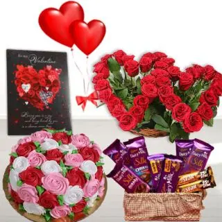 Twin Heart shape roses arrangement ,half kg floral theme cake, basket of silk chocolates,greeting cardwith heart shape balloons 