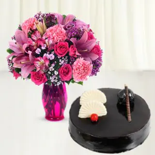 vase arrangement fresh mix flowers with chocolate cake 