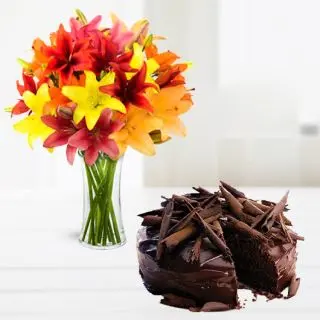 Vase arrangement of 10 mix colour lilies with chocolate truffle premium quality cool cake 