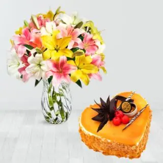 vase arrangement of 10 mix colour lilies with mango heart shape cake 
