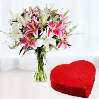 Vase arrangement of 10  pink and white lilies with red velvet heart shape cake 