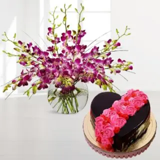 Vase arrangement of 10 purple orchids with chocolate floral theme heart shape cake 