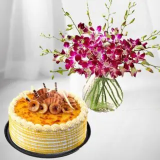 Vase arrangement of 10 purple orchids with Half kg honey cake 