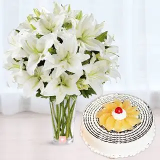 Vase arrangement of 10 white asiatic lilies with 1 kg pineapple cool cake 