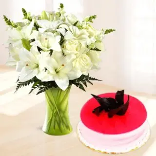 Vase arrangement of 10 white lilies with Half kg strawberry cool cake 