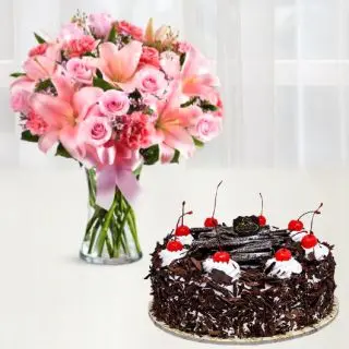Vase arrangement of 15 exotic mix flowers with black forest cool cake 