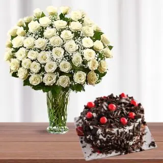 Vase arrangement of 50 white roses with black forest cool cake 