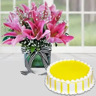 Vase arrangement of 5 pink lilies with pineapple cool cake 