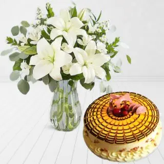 Vase arrangement of 5 white lilies with butterscotch cool cake 