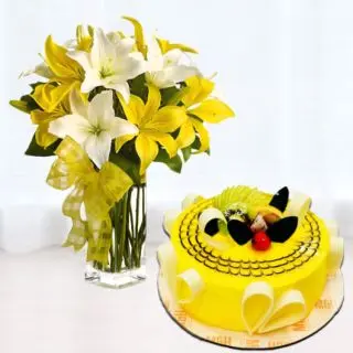 Vase arrangement of 5 yellow and white lilies with premium quality pineapple cool cake 