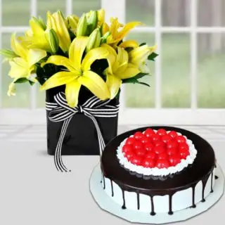 Vase arrangement of 5 yellow lilies with premium quality black  forest cool cake 