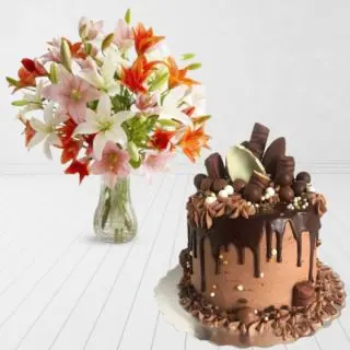 Vase arrangement of 8 mix lilies with chocolate explosion premium quality cake 