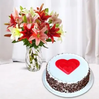 Vase arrangement of 8 mix lilies with black forest cool cake 