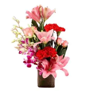 Vase arrangement of carnations lilies with orchids 