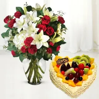vase arrangement of exotic mix flowers with mix fruit premium quality cake 