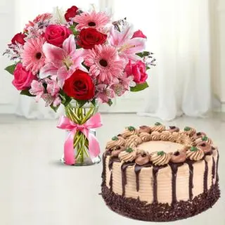 Vase Arrangement of gerberas roses and lilies with chocolate cool cake 