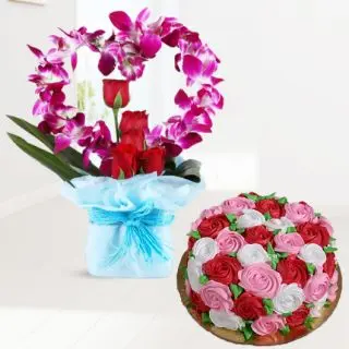 Vase arrangement of lavender orchids with red roses with vanilla floral theme cake 