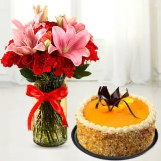 Vase arrangement of lilies and carnations with honey cool cake 