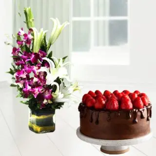 Vase Arrangement of lilies and orchids with choco strawberry cool cake 