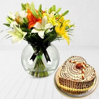 Vase arrangement of mix colour lilies with heart shape butterscotch cake