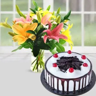 Vase arrangement of mix colour lilies with choco strawberry cool cake 