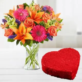 Vase arrangement of mix flowers with heart shape red velvet cool cake 