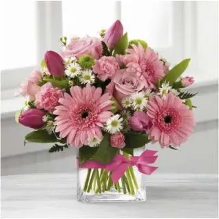 Vase arrangement of pink gerberas with pink roses 