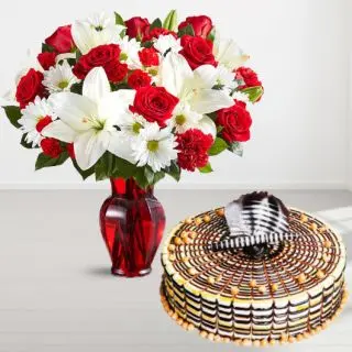 Vase arrangement of white lilies with red roses with 1 kg butterscotch cool cake 