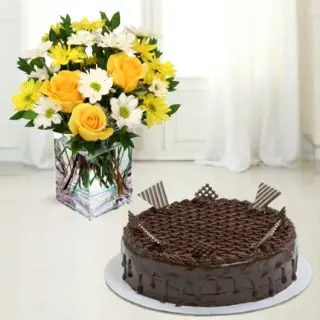 Vase arrangement of yellow roses with white daisy with chocolate cake 
