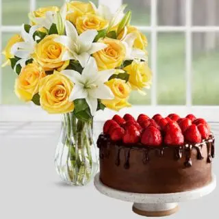 Vase arrangement of yellow roses with white lilies with chocolate strawberry cakes