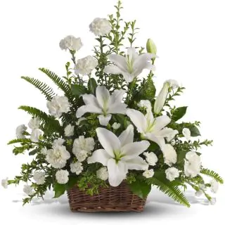 Exotic white flower arrangement of lilies and carnations 