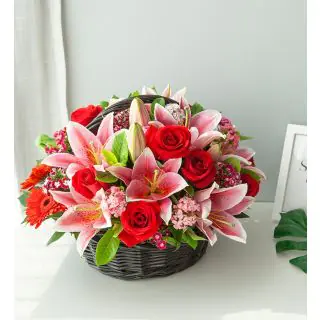 Exotic Basket arrangement of fresh red roses and white lilies 