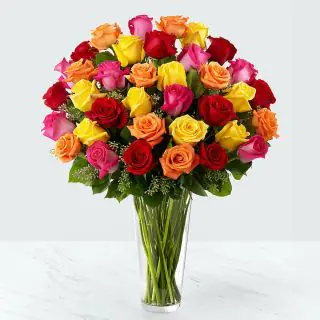 Always Pretty ...A Beautiful Arrangement of 30 Red ,pink and white roses in glass vase 