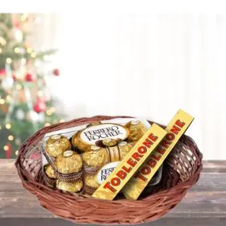 Assorted Chocolate Basket With 16 pcs Ferero Rocher Chocolates With 2 Pack Of Tobleron
