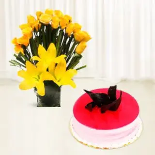 Yellow lilies with yellow roses vase arrangement with strawberry cake 